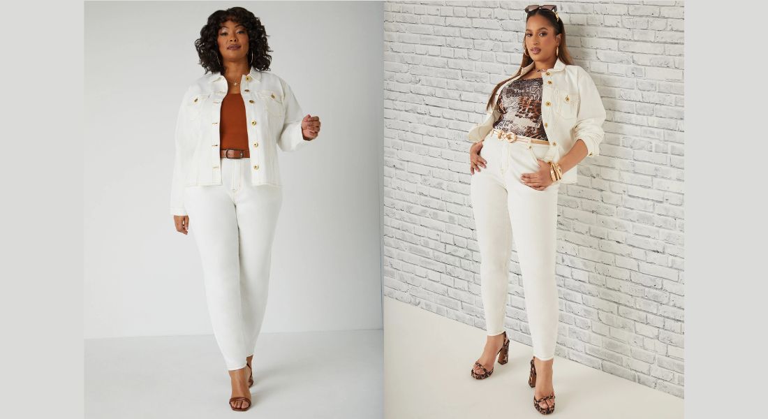Woman in high-waisted, dark-wash jeans with a structured blazer and a crisp white button-down shirt.