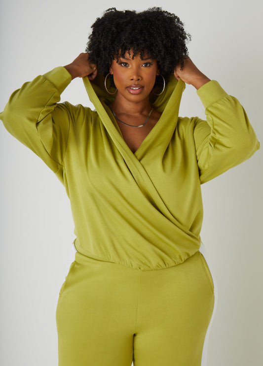 Stretch-knit top with hood, faux wrap neckline and striped trims. Slip-on style. Length: 24in. Can be worn as a two-piece set with matching pants. Pants sold separately.