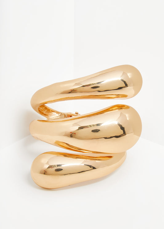 Swirl cuff in gold-tone metal