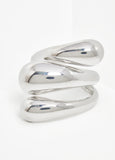 Swirl cuff in silver-tone metal.