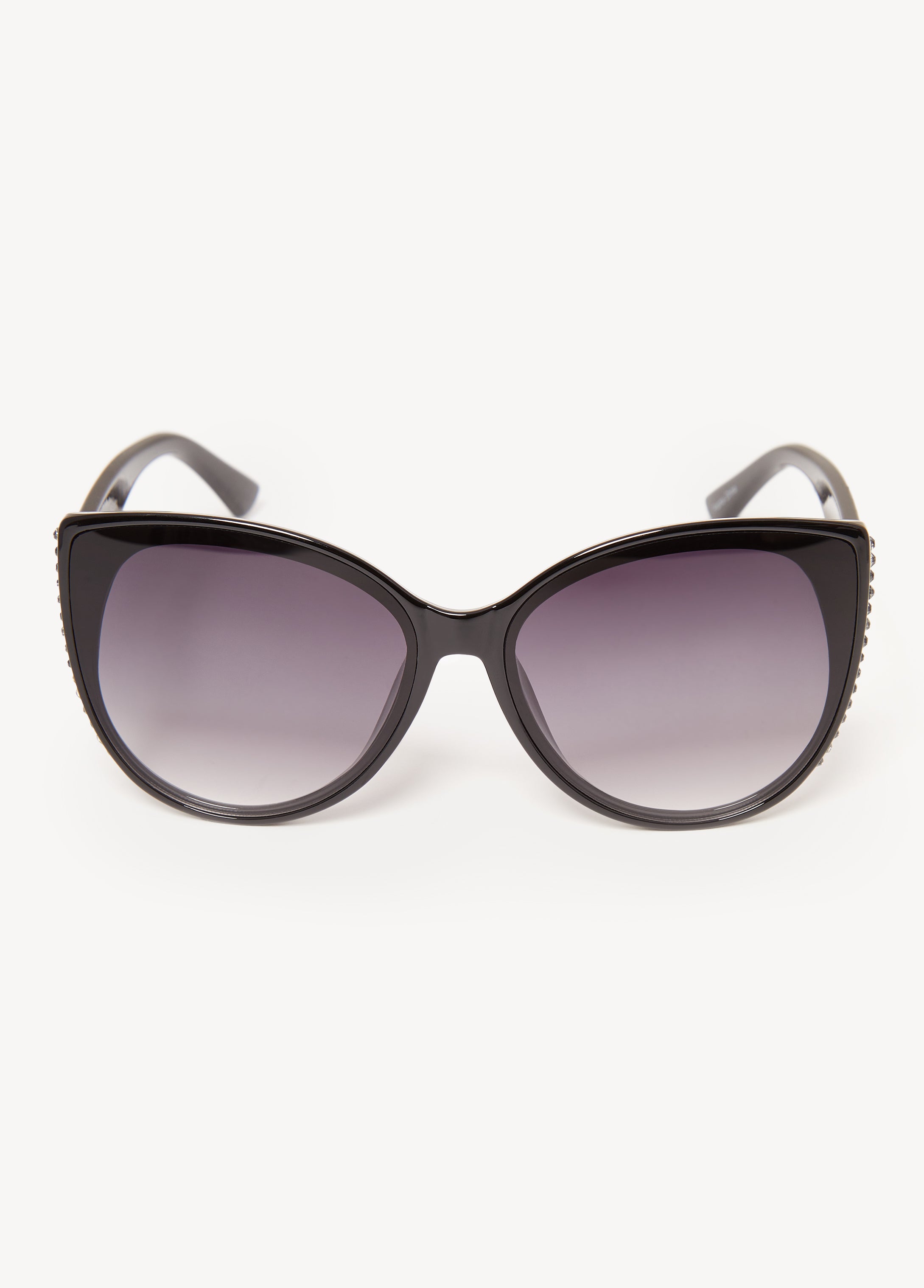 Cat eye-framed sunglasses with crystals and tinted lenses.