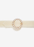 Waist belt with faux pearl embellishments and gold-tone hardware. Buckle fastening at front.